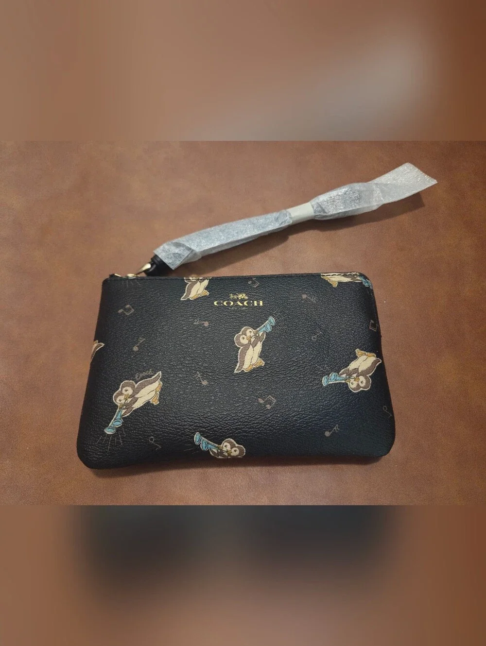 Coach Black Leather Wristlet with Penguin Motif and Gold Logo - Picture 1 of 2